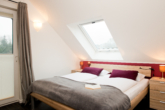 Schlafzimmer Dachgeschoss - Großzügiges Ferienhaus in Strandlage